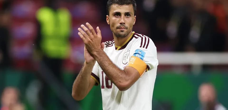 Player applauding fans wearing team jersey