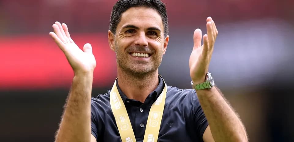 Coach celebrating with winner medal at event