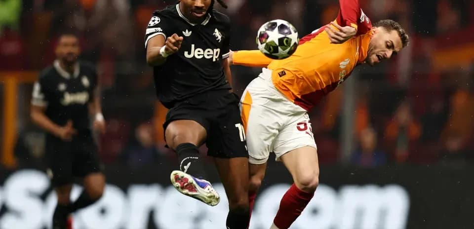Player kicking ball during intense football match action