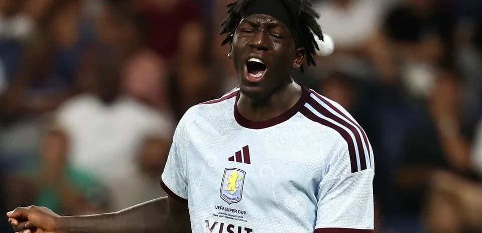 Player in Aston Villa kit shouting during match