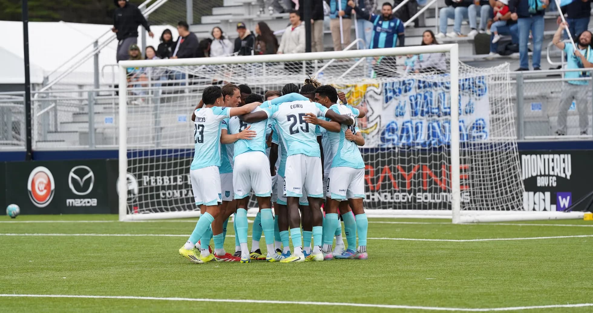 Players celebrating together during match