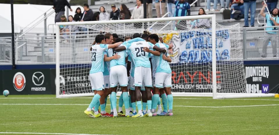 Players celebrating together during match