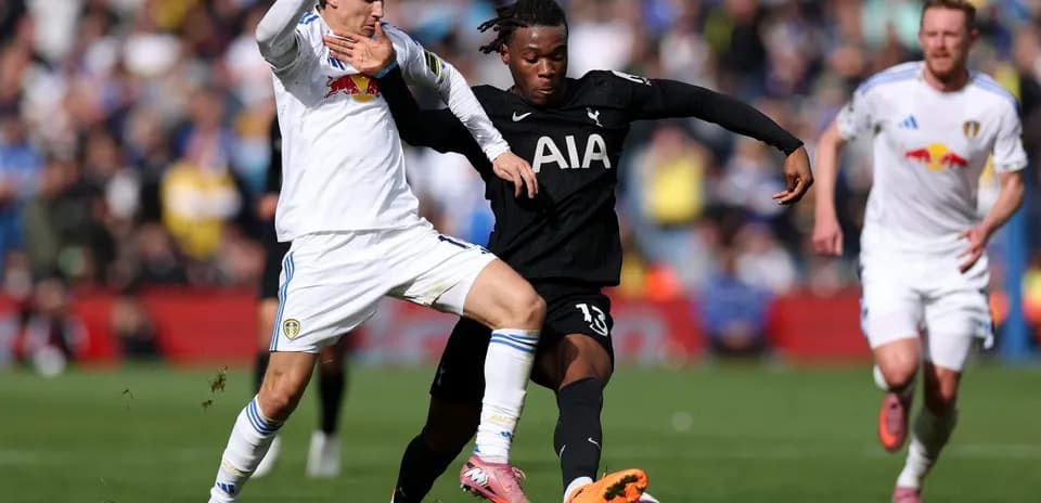 Player from Tottenham tackling Leeds player