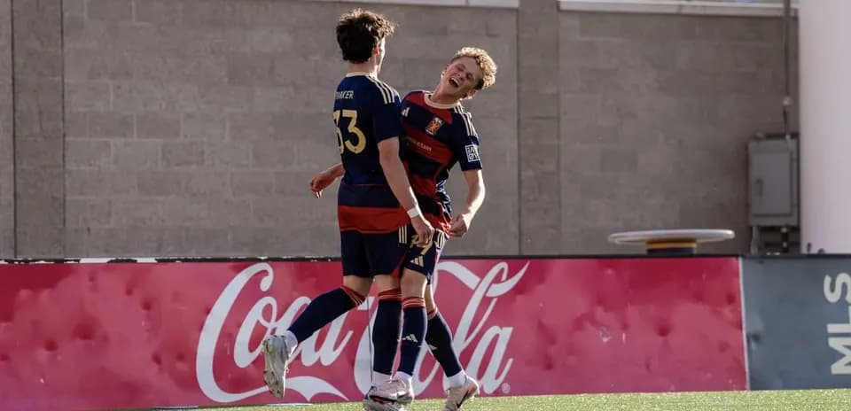 Players celebrating a goal during match