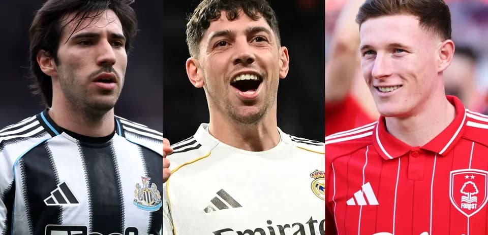 Three football players wearing club jerseys
