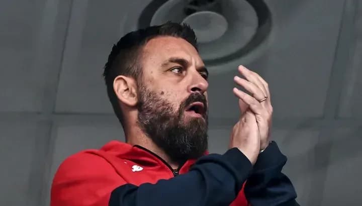 Man applauding in a sports setting