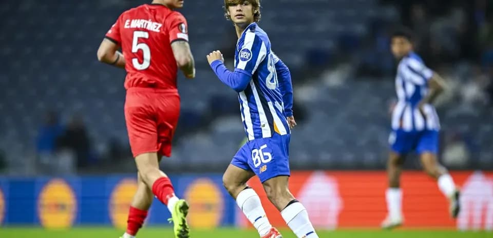 Player in blue jersey running during football match