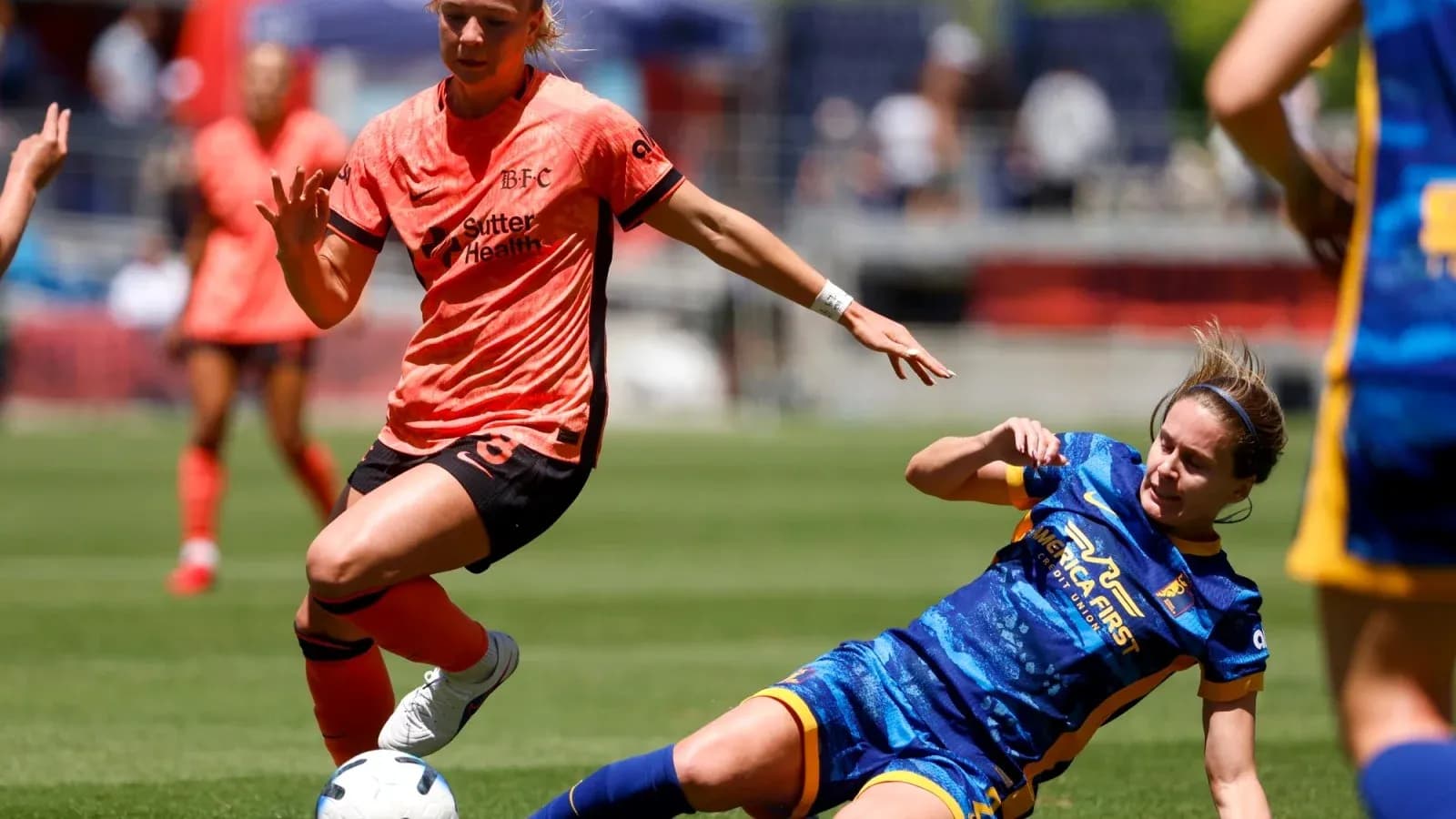 Bay FC player dribbling against Utah Royals defender