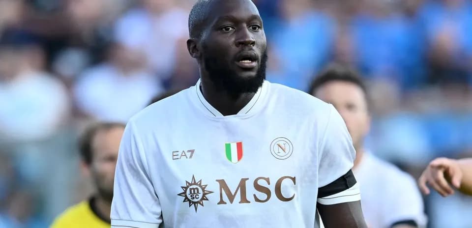 Player in white Napoli kit on the field