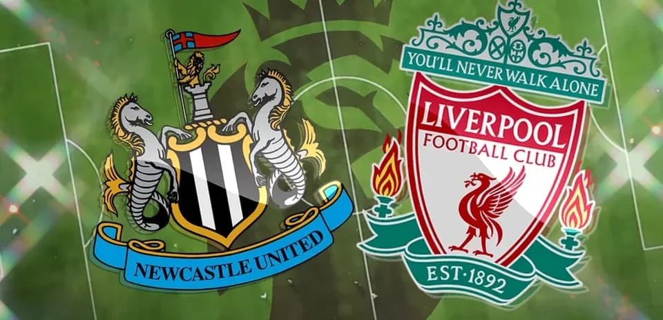 Newcastle United and Liverpool club logos on pitch