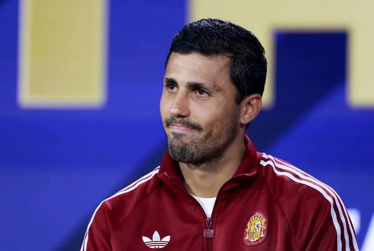 Athlete wearing red jacket at press conference