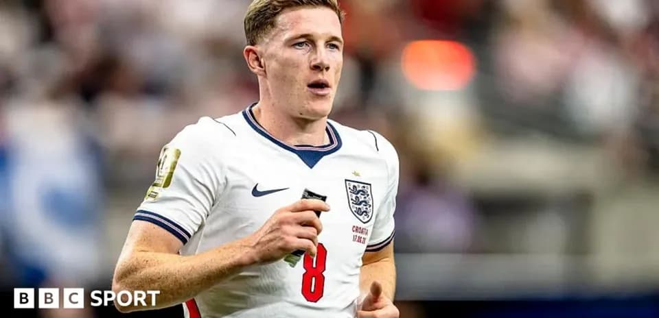 Player wearing England jersey running on the pitch