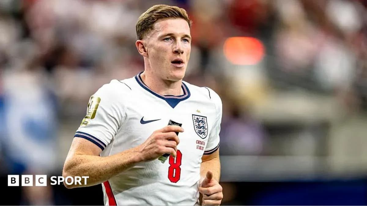 Player wearing England jersey running on the pitch