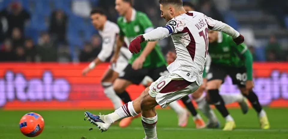 Torino player taking a penalty kick