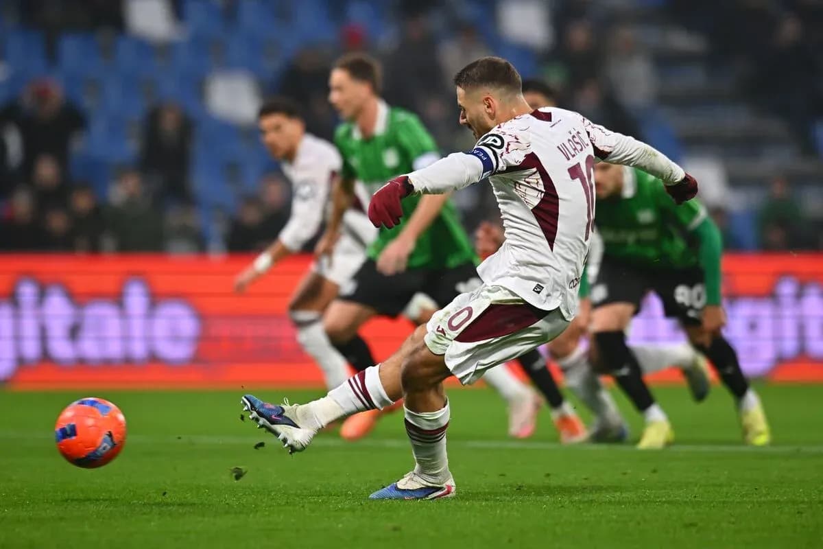 Torino player taking a penalty kick