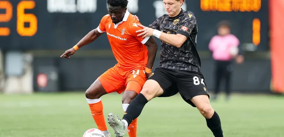Players competing for the ball in match