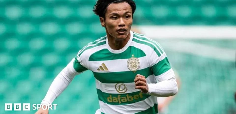Player in Celtic kit running on the pitch