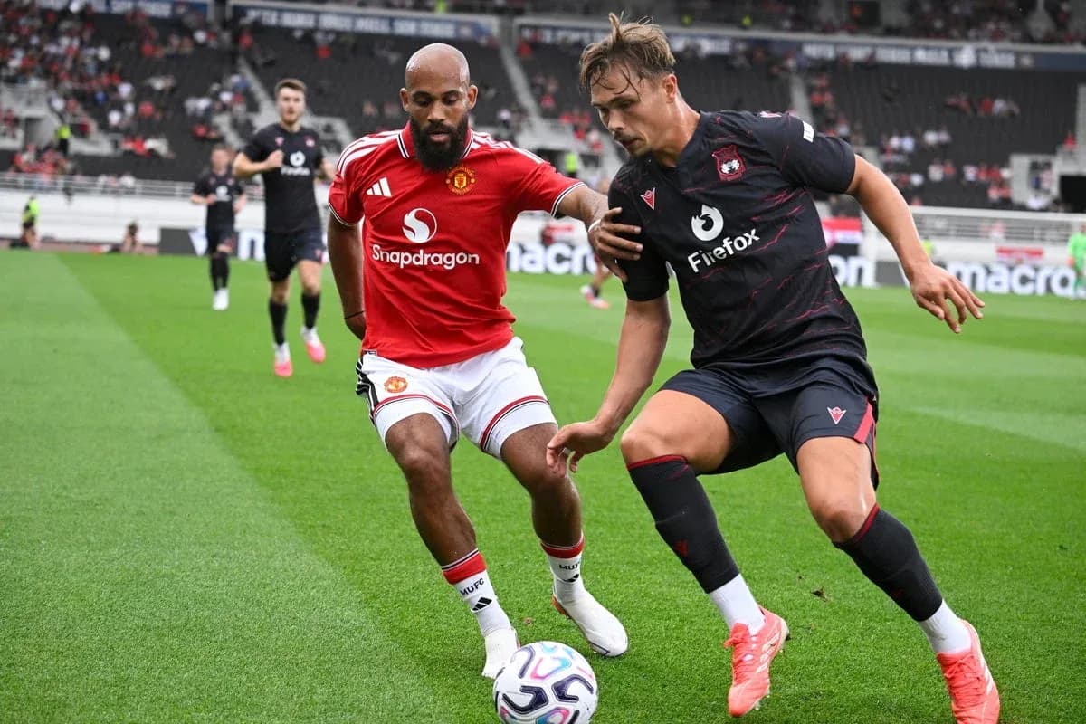 Two players competing for the ball during match