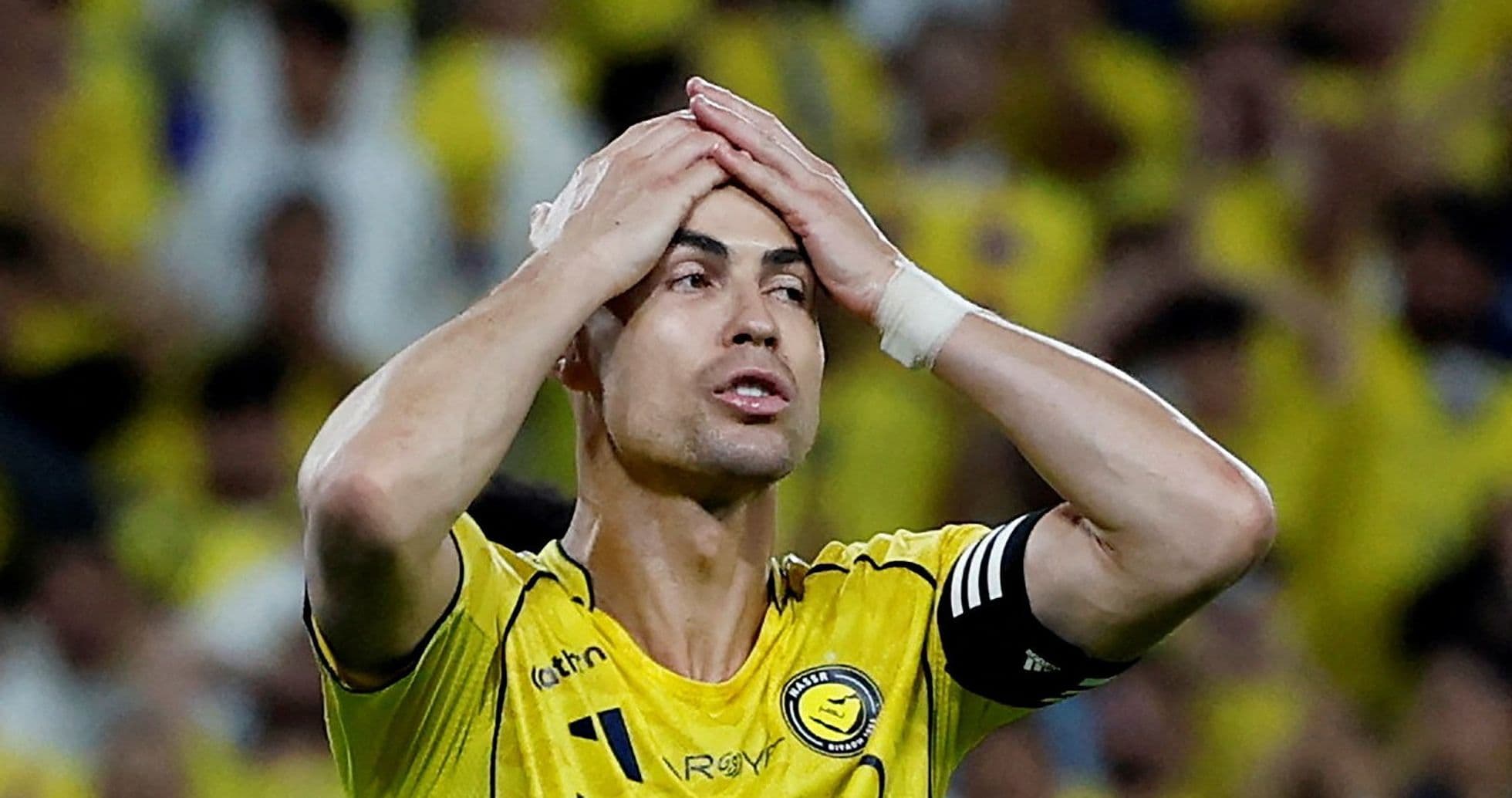 Player holding head in frustration during match