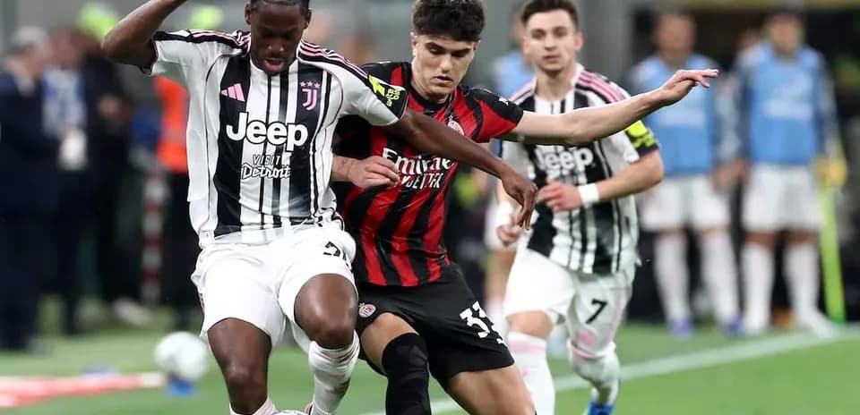 Juventus and AC Milan players battling for the ball