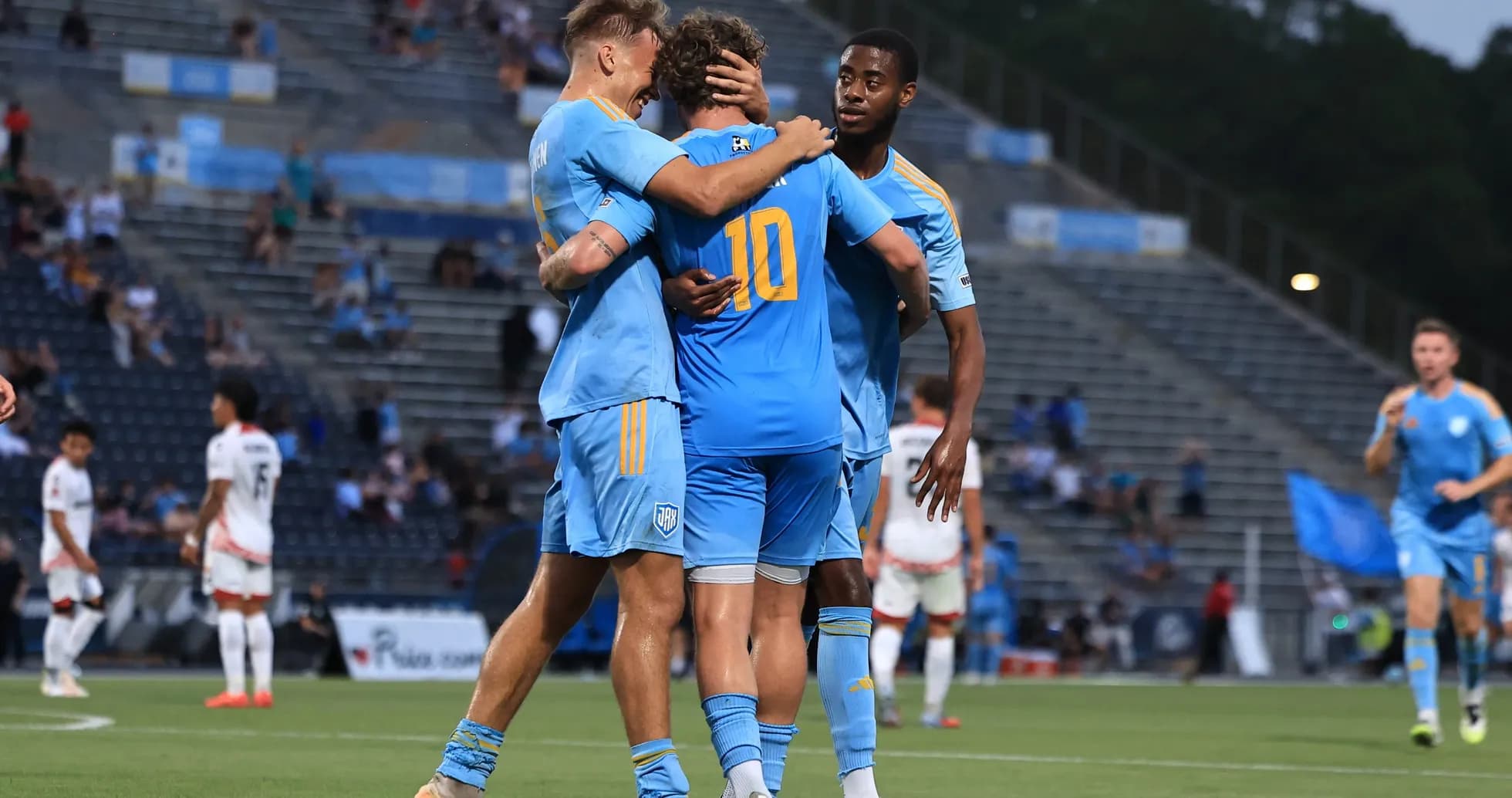 Players celebrating a goal during JAX vs San Antonio