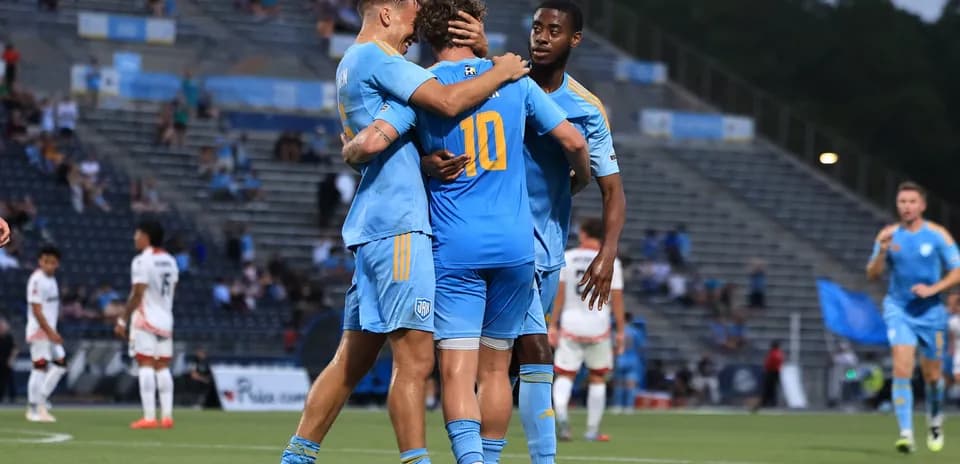 Players celebrating a goal during JAX vs San Antonio