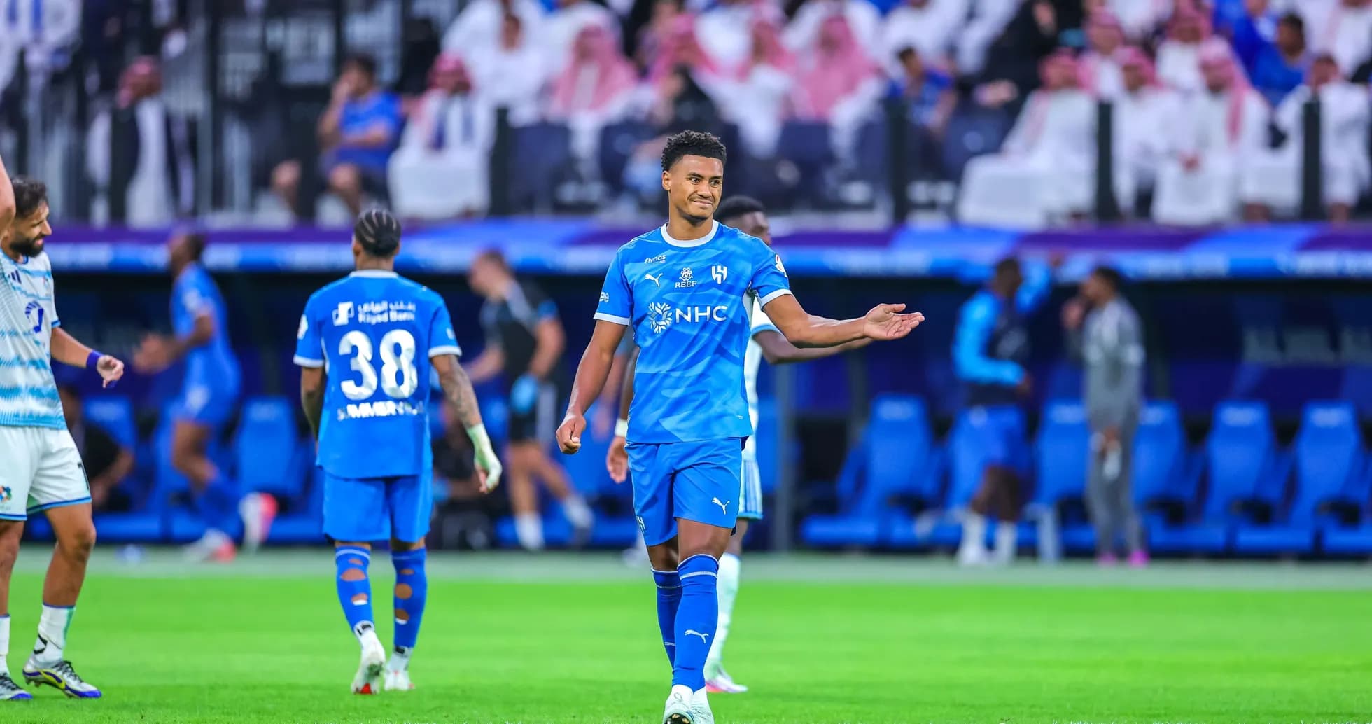 Player gesturing during a football match on field