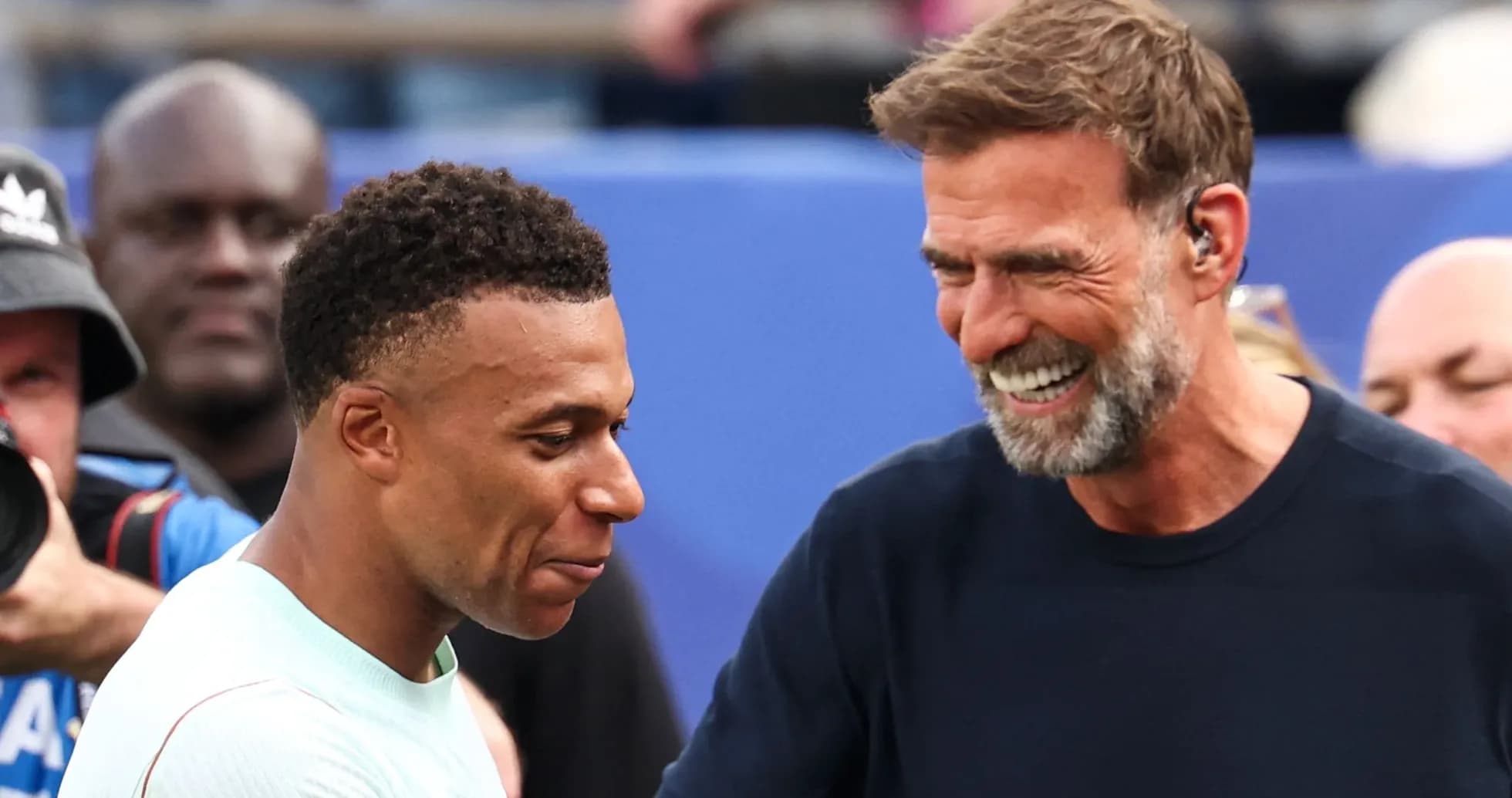 Kylian Mbappé and Jürgen Klopp smiling together