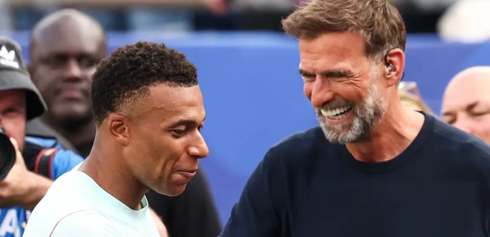 Kylian Mbappé and Jürgen Klopp smiling together