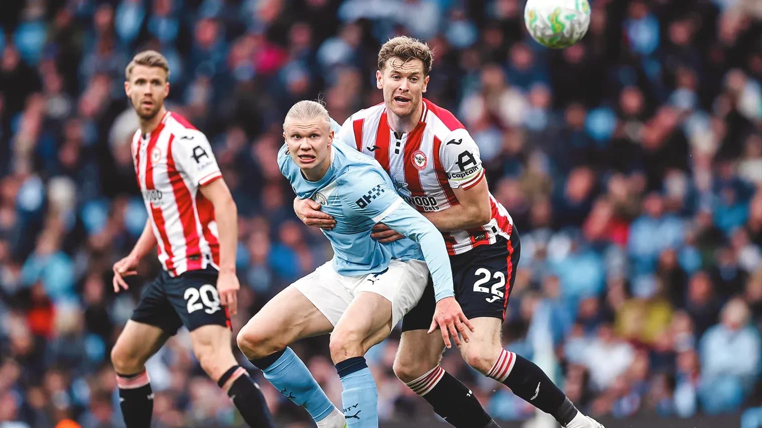 Erling Haaland being challenged during match
