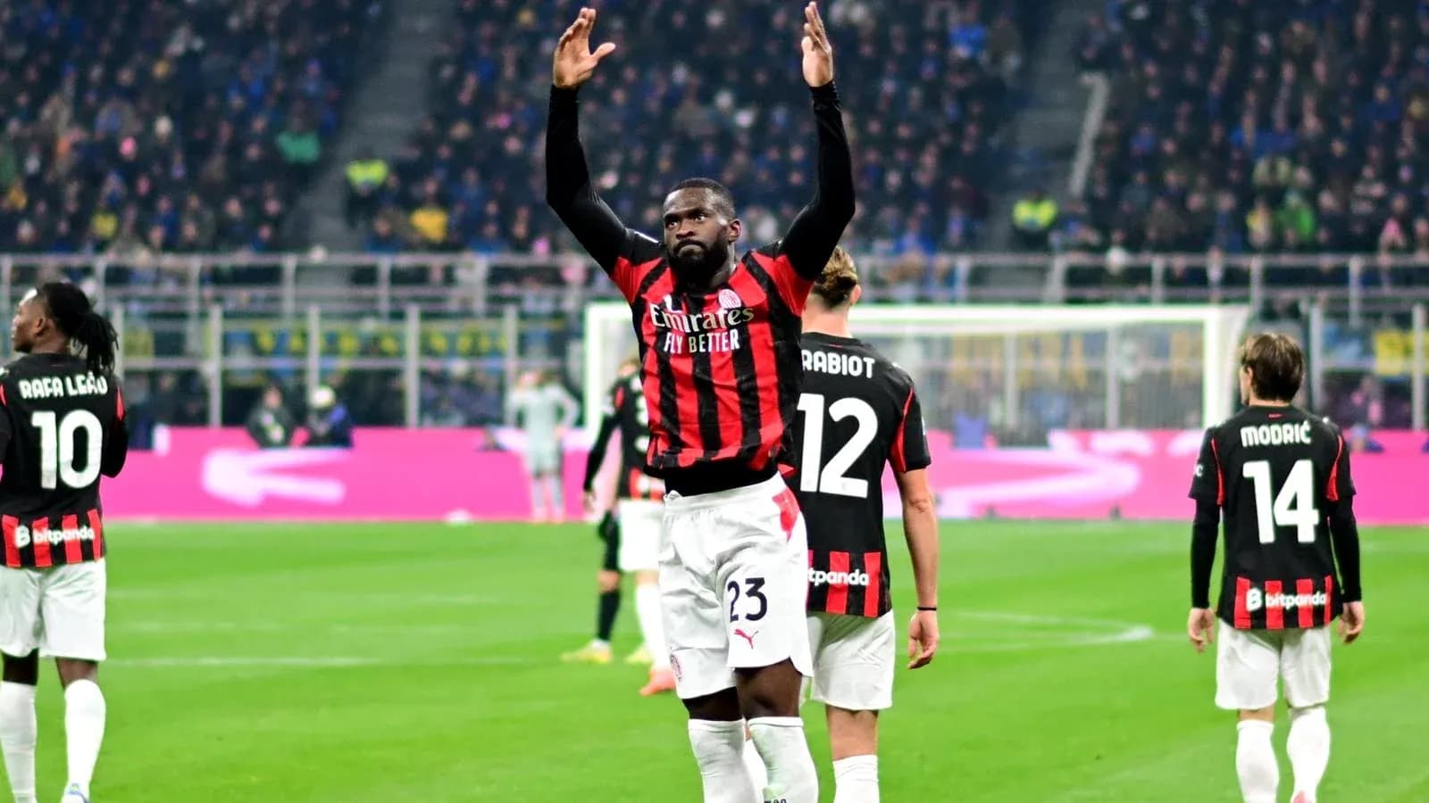 Player celebrating during match with teammates in background