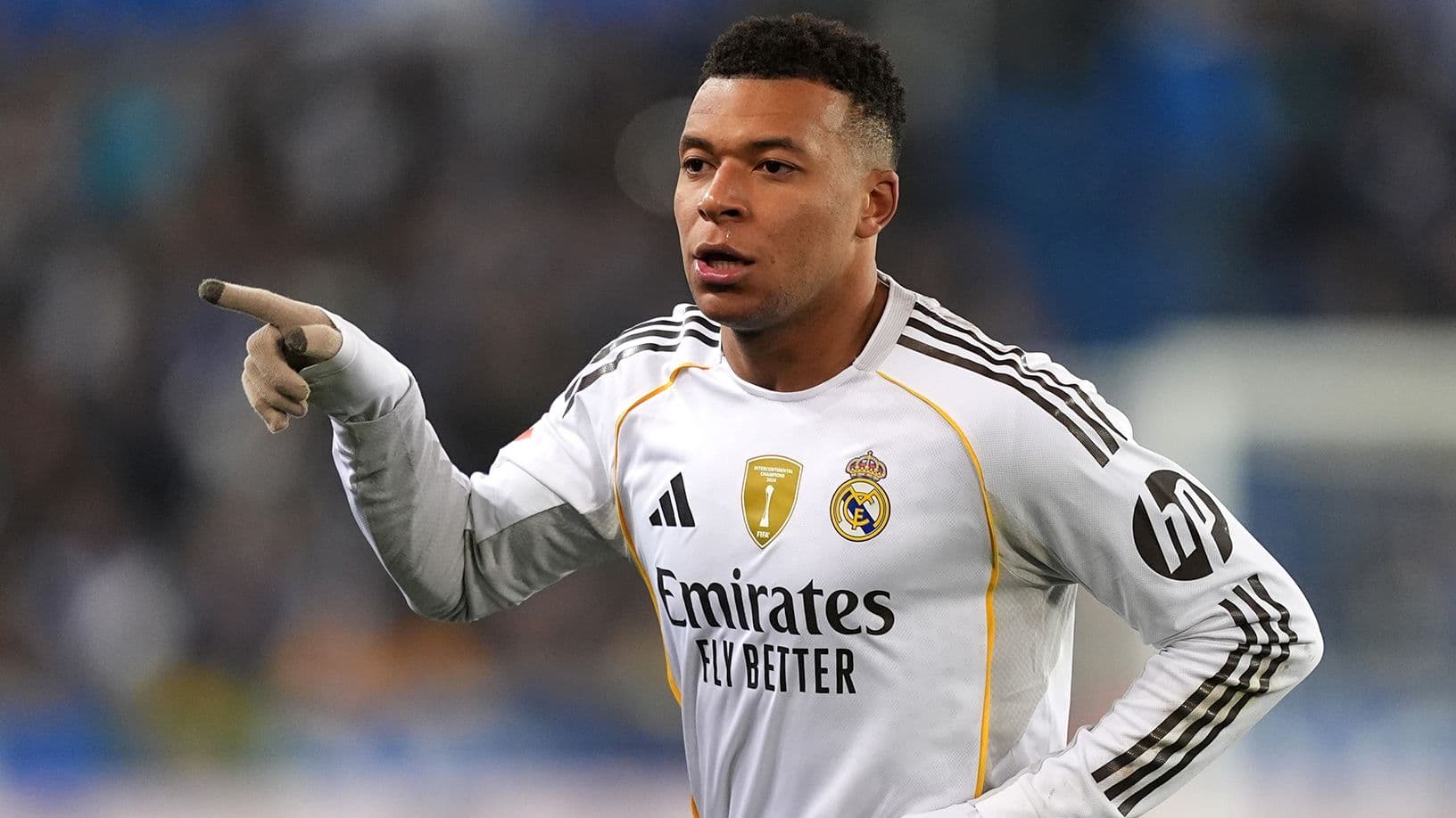 Player pointing during a match for Real Madrid