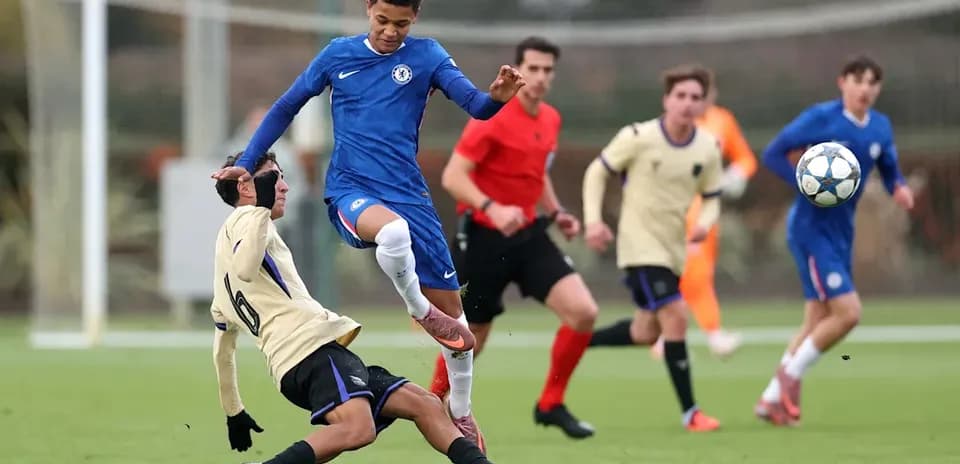 Player in blue jumps over opponent on the field