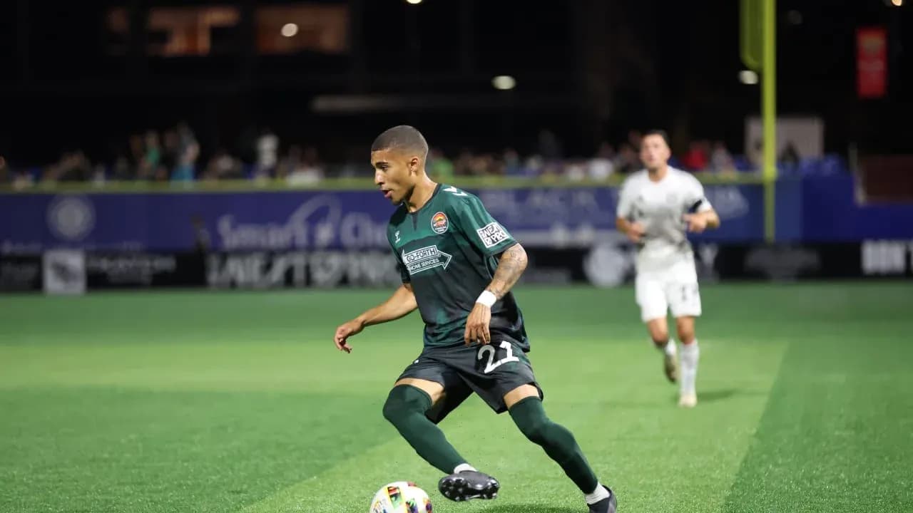 Player dribbling the ball during MLS Next Pro match