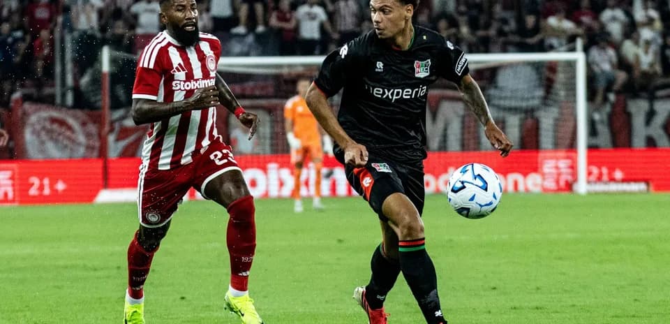 NEC Nijmegen player dribbling against Olympiakos