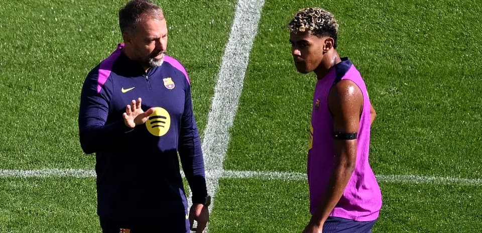 Coach discussing tactics with player during training session