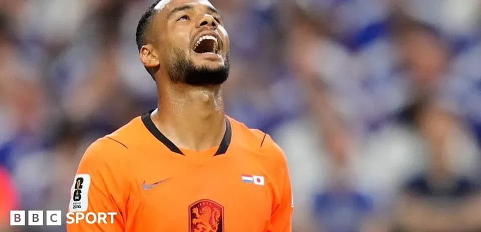 Player in orange jersey reacting during match