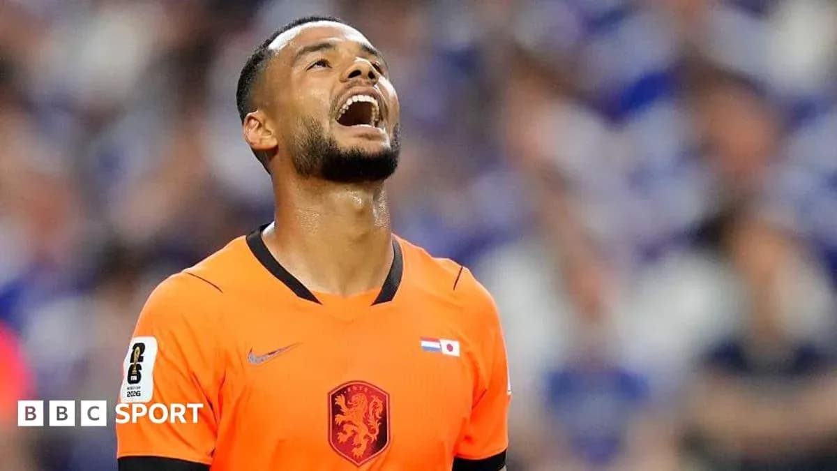 Player in orange jersey reacting during match