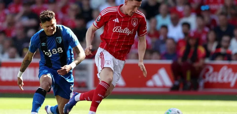 Nottingham Forest player evading Bournemouth defender