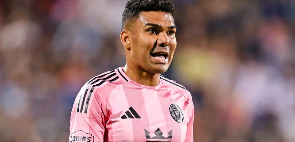 Player in pink jersey shouting during a match