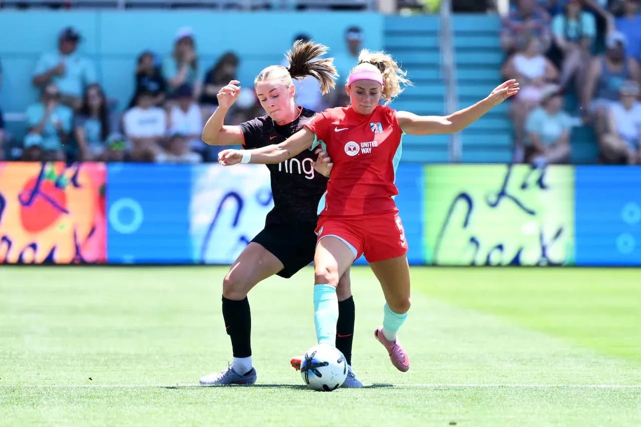 Two players contesting for the ball in match