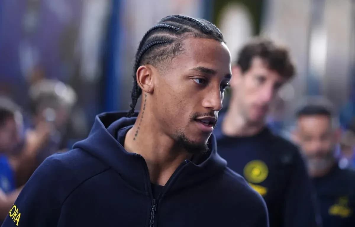 Player with braided hair walking in team apparel