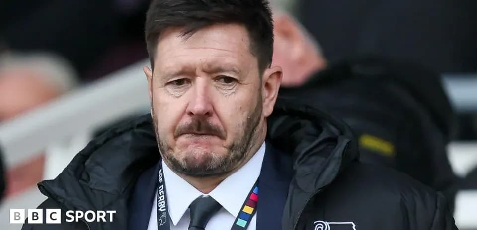 Manager looking serious on the sidelines during match