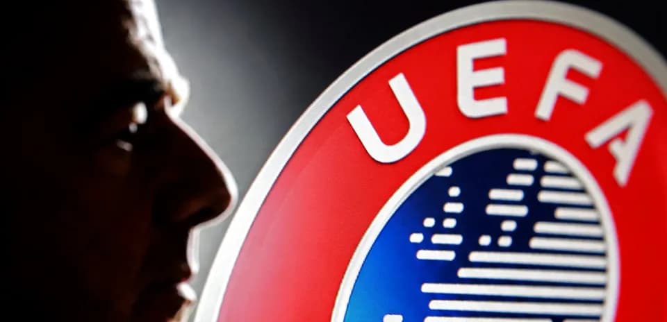 Profile silhouette beside UEFA logo