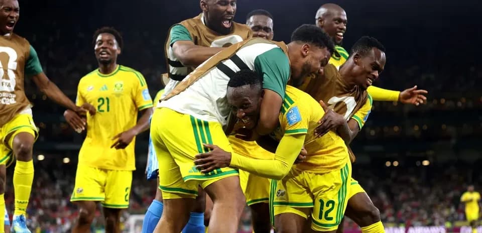 Players celebrating after scoring a goal