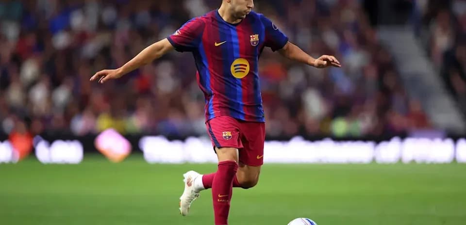Barcelona player dribbling ball during match