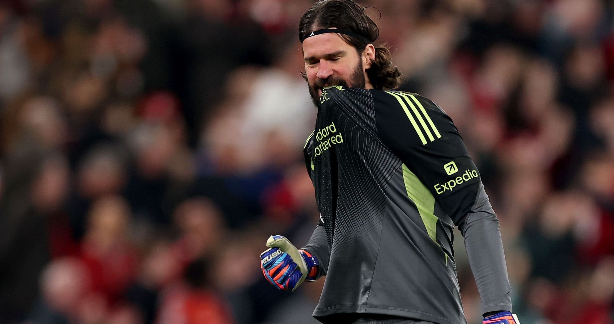 Goalkeeper celebrating in front of crowd
