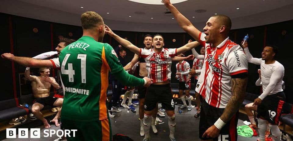Players celebrating in locker room after match victory