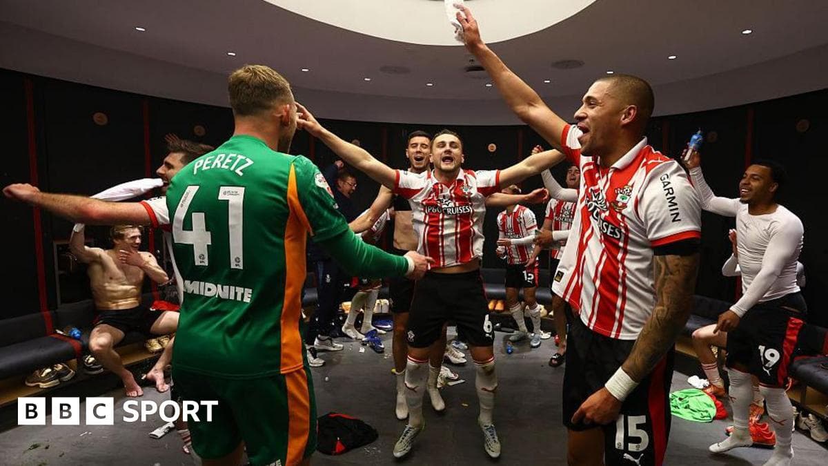 Players celebrating in locker room after match victory