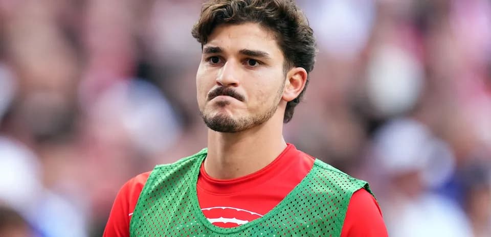Player wearing training vest on the sidelines